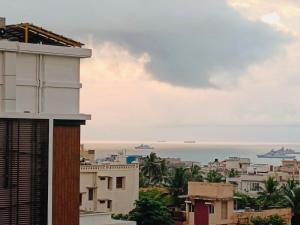 a view of the ocean from a building at Crystal dew in Visakhapatnam