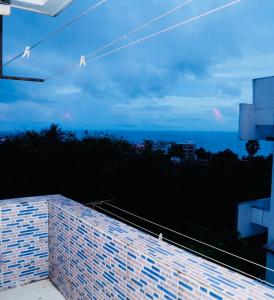 a view of the ocean from a balcony at Crystal dew in Visakhapatnam