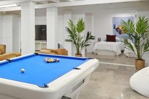 a living room with a pool table in it at The Queenslander! Complete Entertainer - Huge - Stylish - Games - Full Level Pool Room - Smokehouse - Secure Parking - Yard #NEW! in Gold Coast