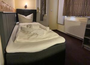 Postel nebo postele na pokoji v ubytování Hotel Carl von Clausewitz