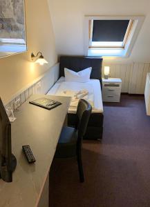 Postel nebo postele na pokoji v ubytování Hotel Carl von Clausewitz
