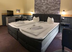Postel nebo postele na pokoji v ubytování Hotel Carl von Clausewitz