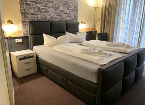 Postel nebo postele na pokoji v ubytování Hotel Carl von Clausewitz