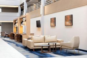 a lobby with couches and chairs and a bar at Fairfield Inn & Suites by Marriott Denver Southwest/Lakewood in Lakewood
