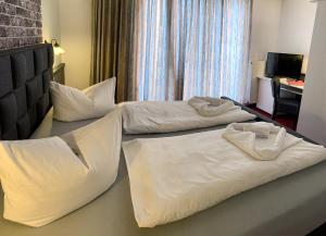 Postel nebo postele na pokoji v ubytování Hotel Carl von Clausewitz