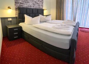 Postel nebo postele na pokoji v ubytování Hotel Carl von Clausewitz