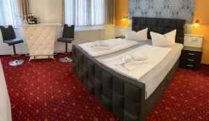 Postel nebo postele na pokoji v ubytování Hotel Carl von Clausewitz