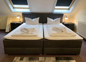 Postel nebo postele na pokoji v ubytování Hotel Carl von Clausewitz