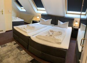 Postel nebo postele na pokoji v ubytování Hotel Carl von Clausewitz