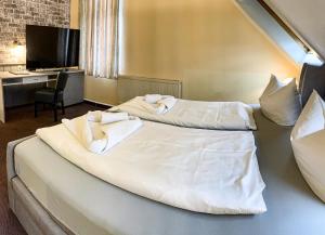 Postel nebo postele na pokoji v ubytování Hotel Carl von Clausewitz