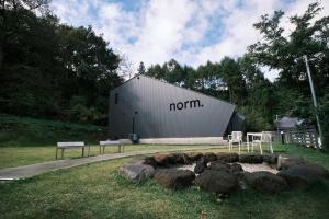 a barn with a sign on the side of it at hotel norm. fuji in Fujikawaguchiko