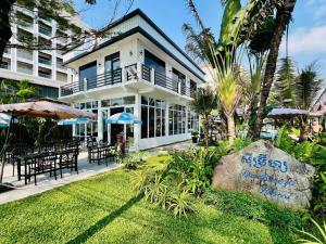 a building with a large rock in front of it at Sea Breeze Resort in Sihanoukville