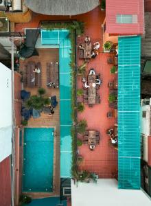 an overhead view of a patio with a pool at The One Hostel Hanoi in Hanoi