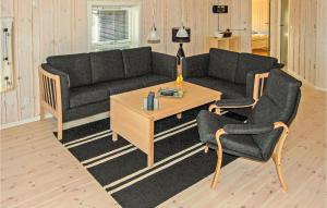 a living room with a couch and two chairs and a table at Beautiful Home In Nordborg With 3 Bedrooms, Sauna And Wifi in Nordborg