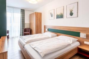 Postel nebo postele na pokoji v ubytování Leonfeldner-Hof + 37 fotografií