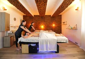 a group of people in a room with beds at Negrecoste Hôtel & Spa in Aix-en-Provence