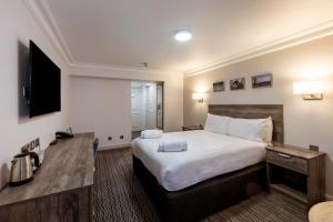Postel nebo postele na pokoji v ubytování Copthorne Aberdeen Hotel