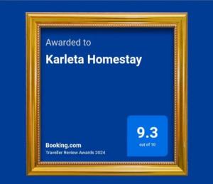 a gold picture frame with the words awarded to katta homogeneity at Karleta Homestay in Ruteng