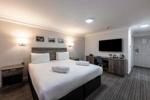 Postel nebo postele na pokoji v ubytování Copthorne Aberdeen Hotel