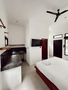 Cama ou camas em um quarto em Susurro Residential