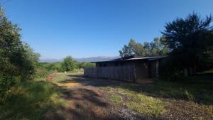 an old building in the middle of a field at HOLLYBROOKE Campsites in Skeerpoort