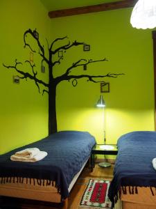Postel nebo postele na pokoji v ubytování Guest Accommodation Etno Konak Tašana