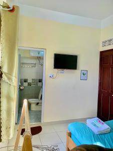 TV o dispositivi per l'intrattenimento presso Gold's House
