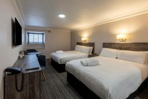 Postel nebo postele na pokoji v ubytování Copthorne Aberdeen Hotel