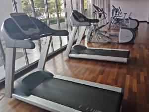 a gym with two exercise bikes in a room at Silverscape Seaview Residence Melaka in Melaka