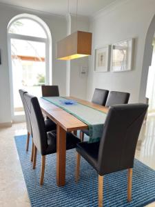 a dining room with a table and chairs at Villa Michael in St Paul's Bay