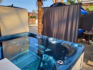 a jacuzzi tub in a backyard at Aqua House Admirał in Mielno