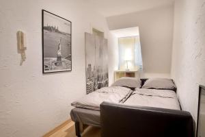 a bedroom with a bed and a picture on the wall at 5 Secret escape apartment above Stuttgart in Stuttgart