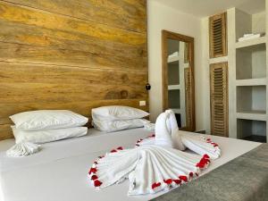 Postel nebo postele na pokoji v ubytování Beachfront White Pearl Suite ZanzibarHouses