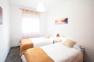 Katil atau katil-katil dalam bilik di Luna Apartment by A3Rentals