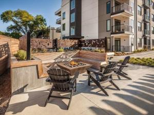 a patio with two chairs and a fire pit at CozySuites Nora 2BR next to Whole Foods in Indianapolis