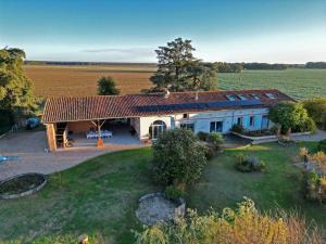 an aerial view of a house in the middle of a field at La Garoffe in Pibrac