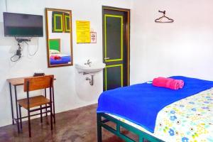 Postelja oz. postelje v sobi nastanitve Sonosewu Guesthouse Syariah