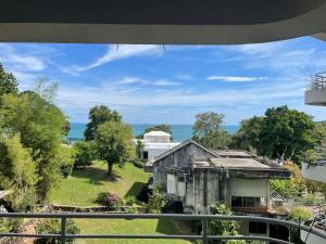 a view from the balcony of an old house at TRIPLET Suite Rayong Seaview Private Beach in Ban Ko Kok