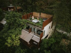 an aerial view of a house in the woods at Te Mata Glamping in Nong Nam Daeng