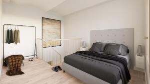 a bedroom with a large bed in a white room at Style Madrid Center Santiago Bernabeu in Madrid
