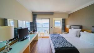 TV a/nebo společenská místnost v ubytování Cettia Beach Resort