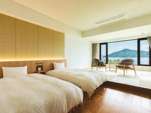 Postel nebo postele na pokoji v ubytování Etajimasou Hotel & SPA Hiroshima