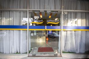 a glass door of a building with a car in it at SUN INNS PERMAS JAYA in Johor Bahru