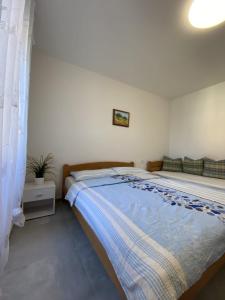 Postel nebo postele na pokoji v ubytování Apartmani Radosav