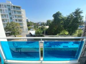 a view from the balcony of a building with a large aquarium at My Resort Family Huahin in Hua Hin
