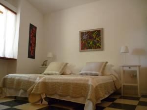 A bed or beds in a room at Seafront Villa Aggeliki