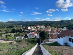 a view of a small town from a hill at Refugio Abrunheiro Grande in Vila de Rei