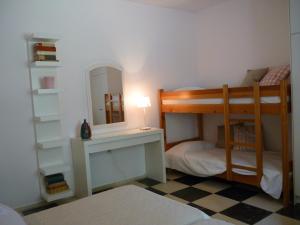 A bed or beds in a room at Seafront Villa Aggeliki