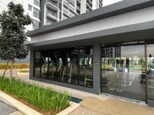 a building with large glass windows in a city at Executive Escapes [The Netizen Cheras] 3房公寓 #MRT in Cheras