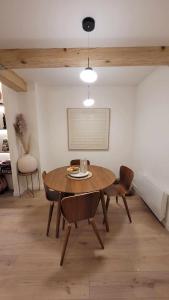 a dining room with a table and two chairs at Verdon - Appartement d'Architecte in Comps-sur-Artuby